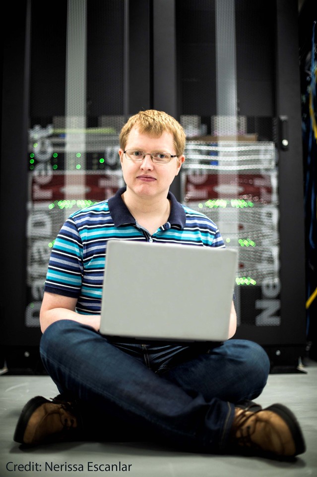 Jakob Andersen EON postdoc standing by ELSIÅfs computer Photo credit Nerissa Escanlar_credited.jpg